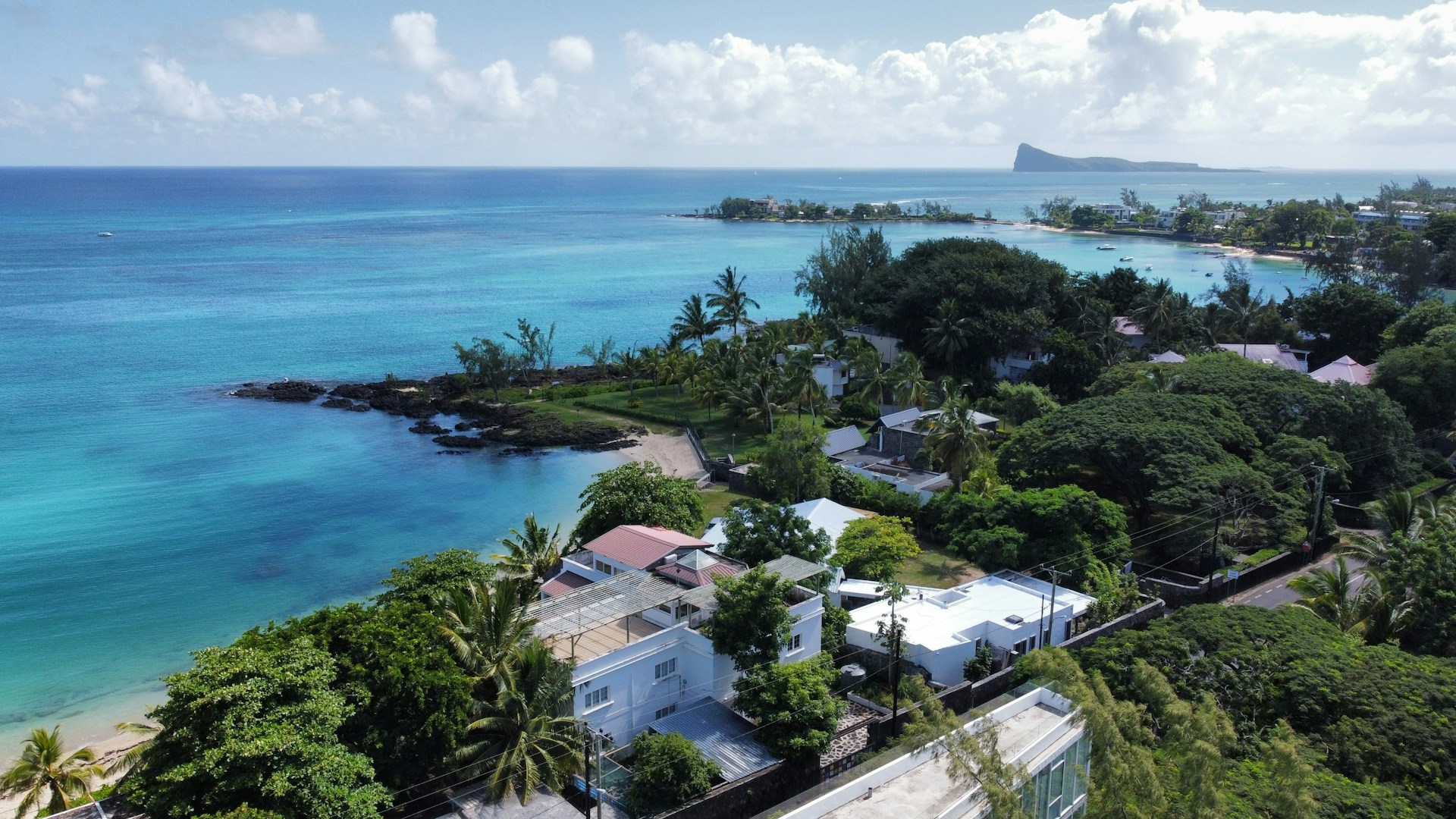 woman wearing yellow long-sleeved dress under white clouds and blue sky during daytime