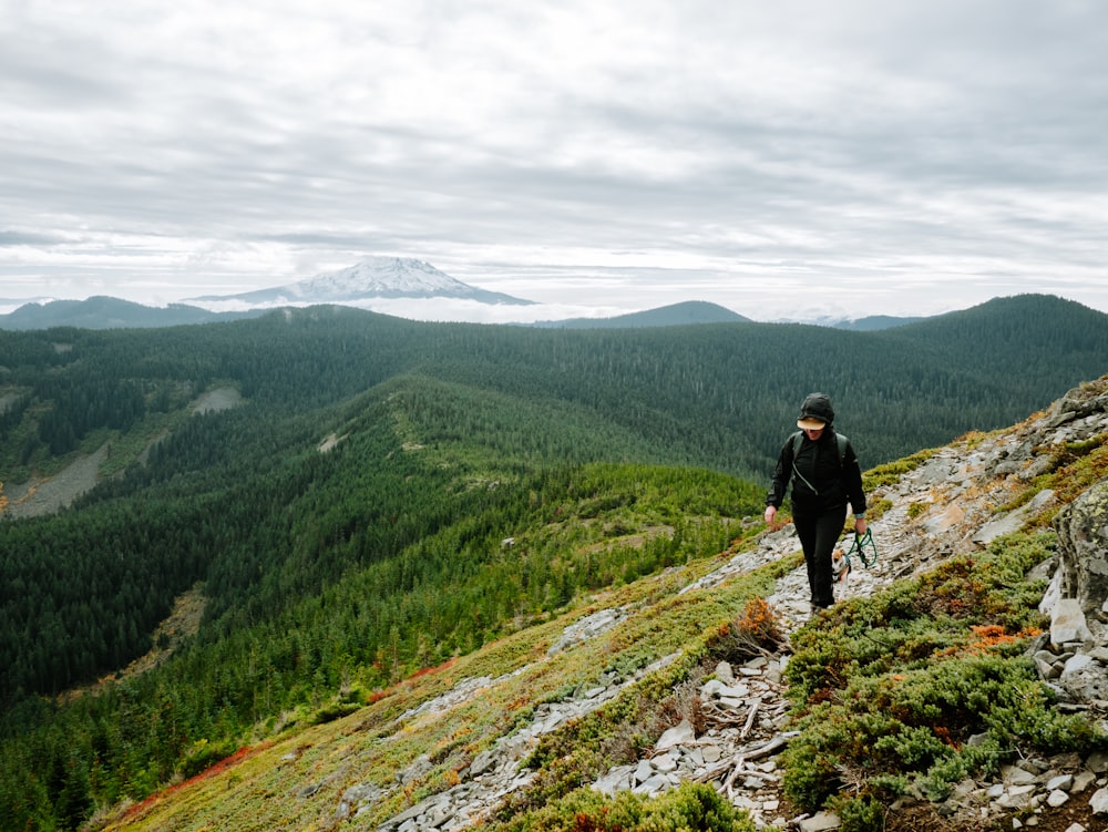 a man hiking up the side of a mountain