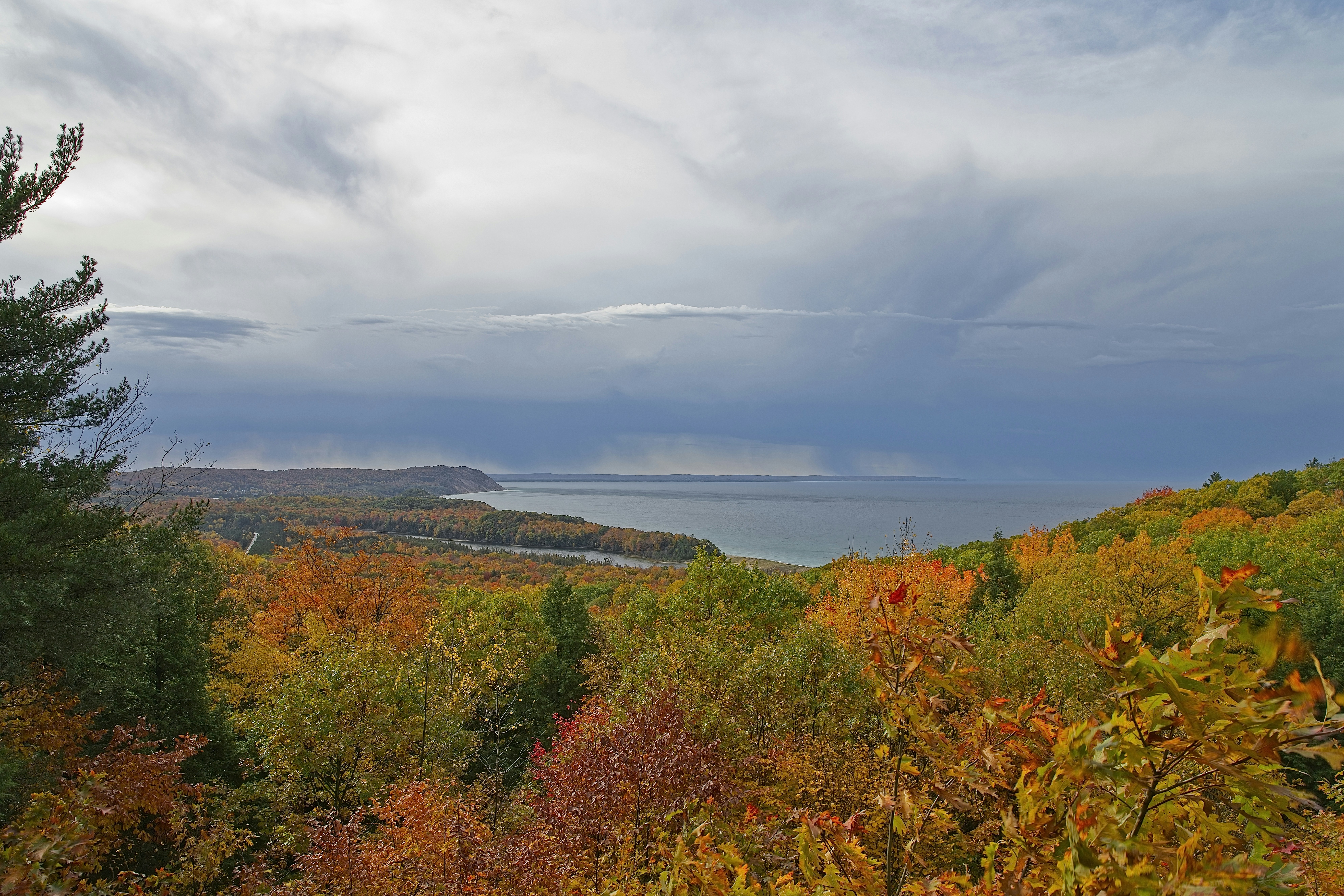 a scenic view of a lake surrounded by trees