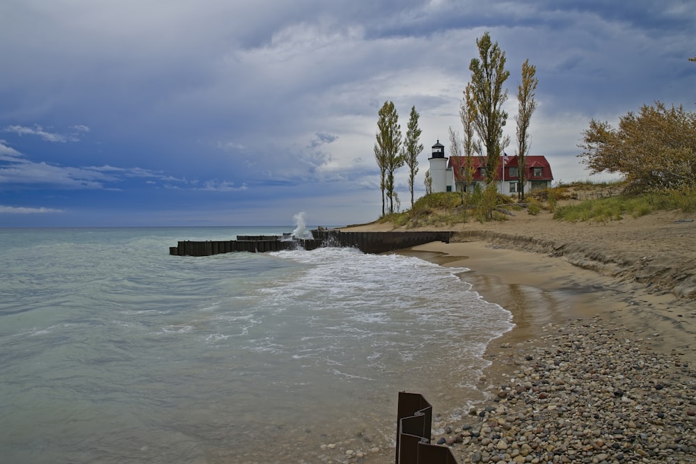 a house on the shore of a beach