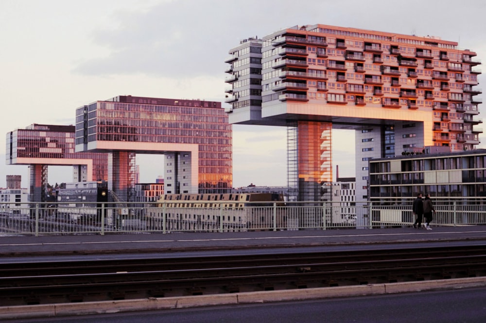 a couple of tall buildings sitting next to each other