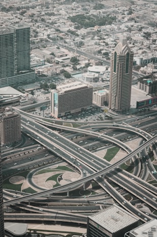 an aerial view of a highway intersection in a city