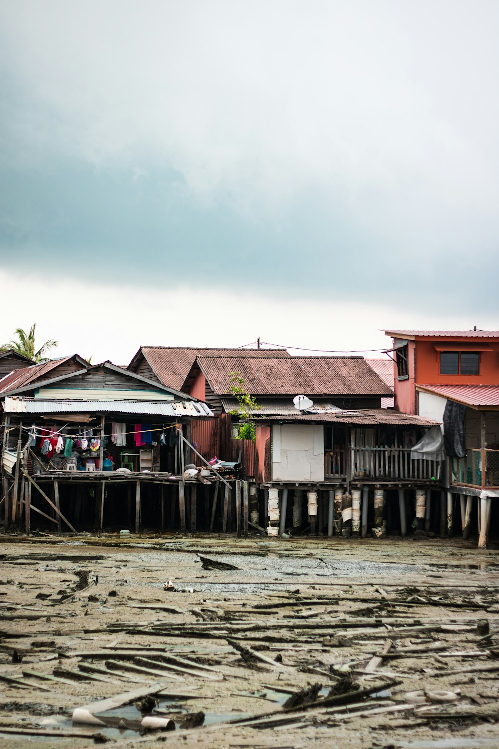 a group of houses sitting next to a body of water