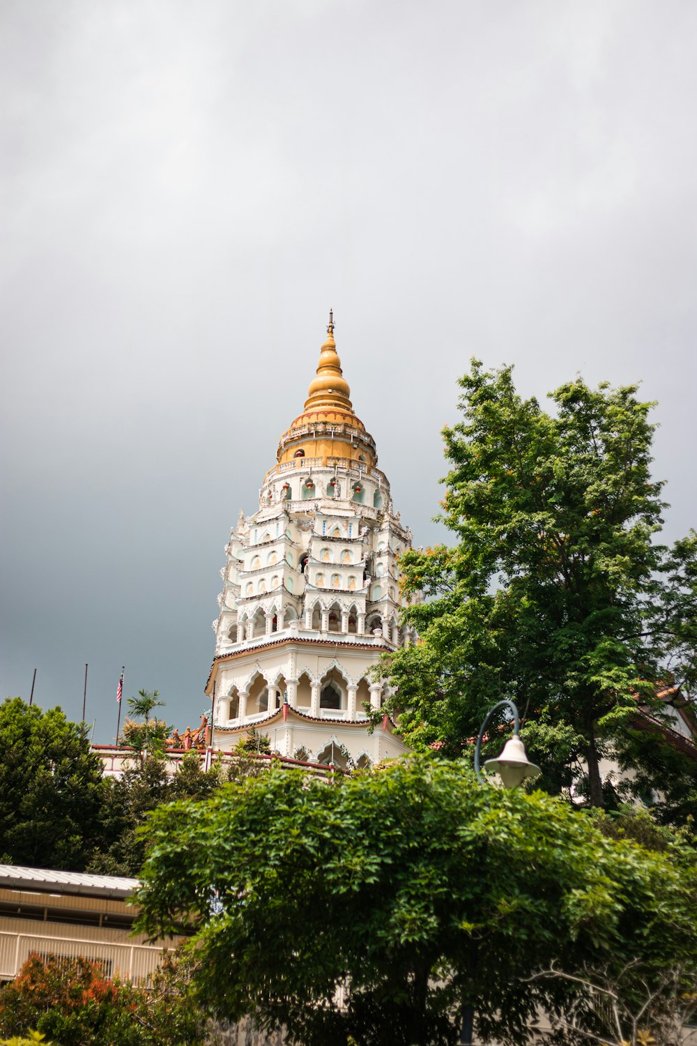 a tall white building with a golden dome