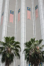 Certificate of completion displayed alongside Malaysian business icons.