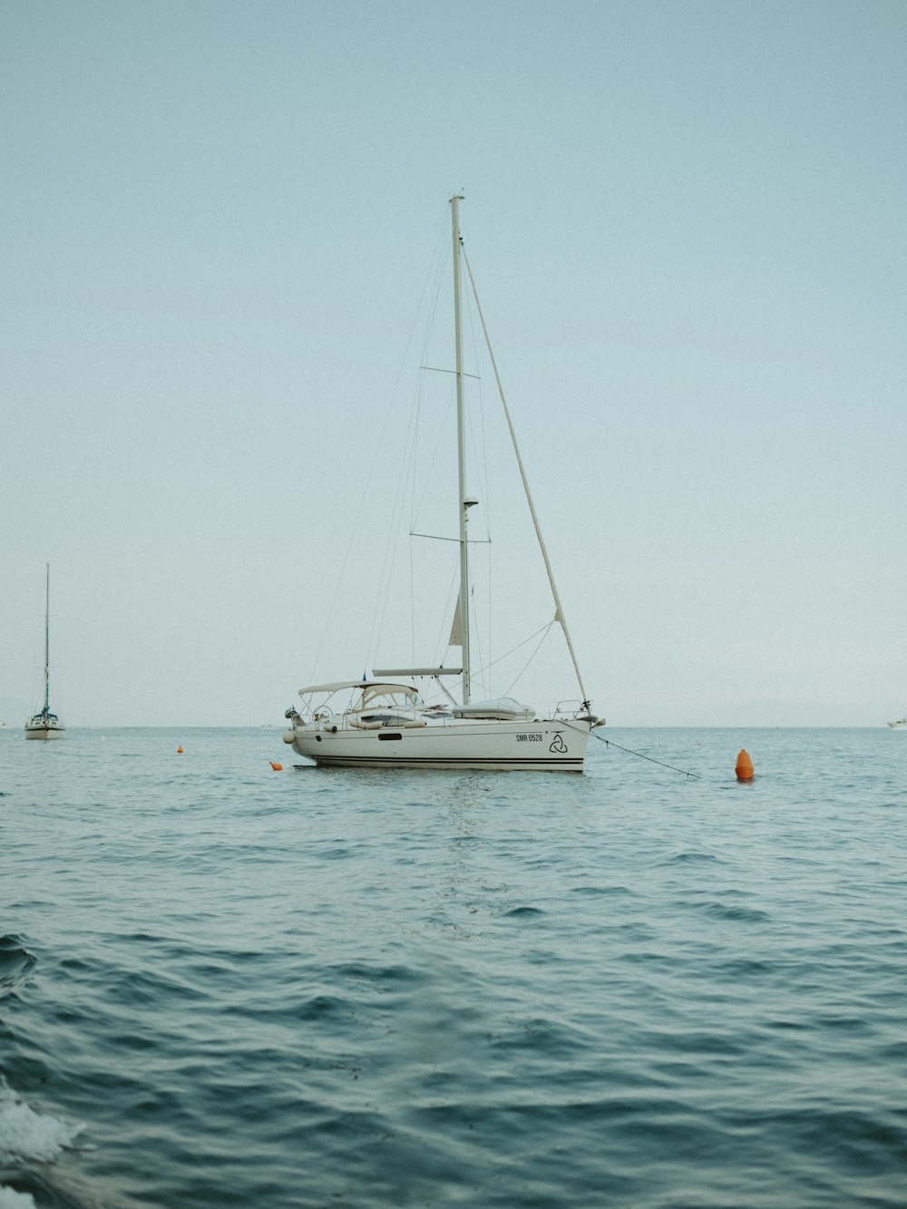 a sailboat in the middle of the ocean