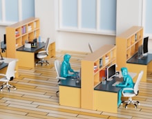 a model of a room with desks and chairs