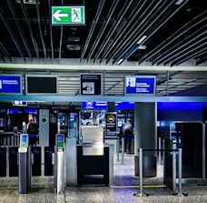 An airport fast-track lane with a traveler breezing through security.