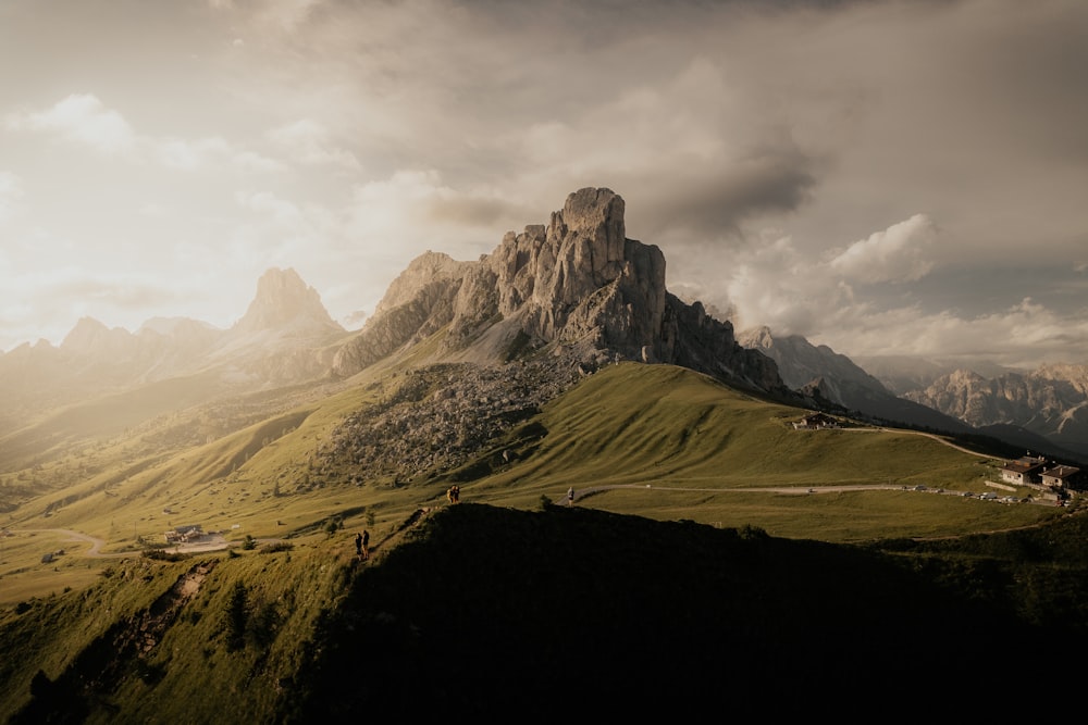 a view of a mountain range with clouds in the sky