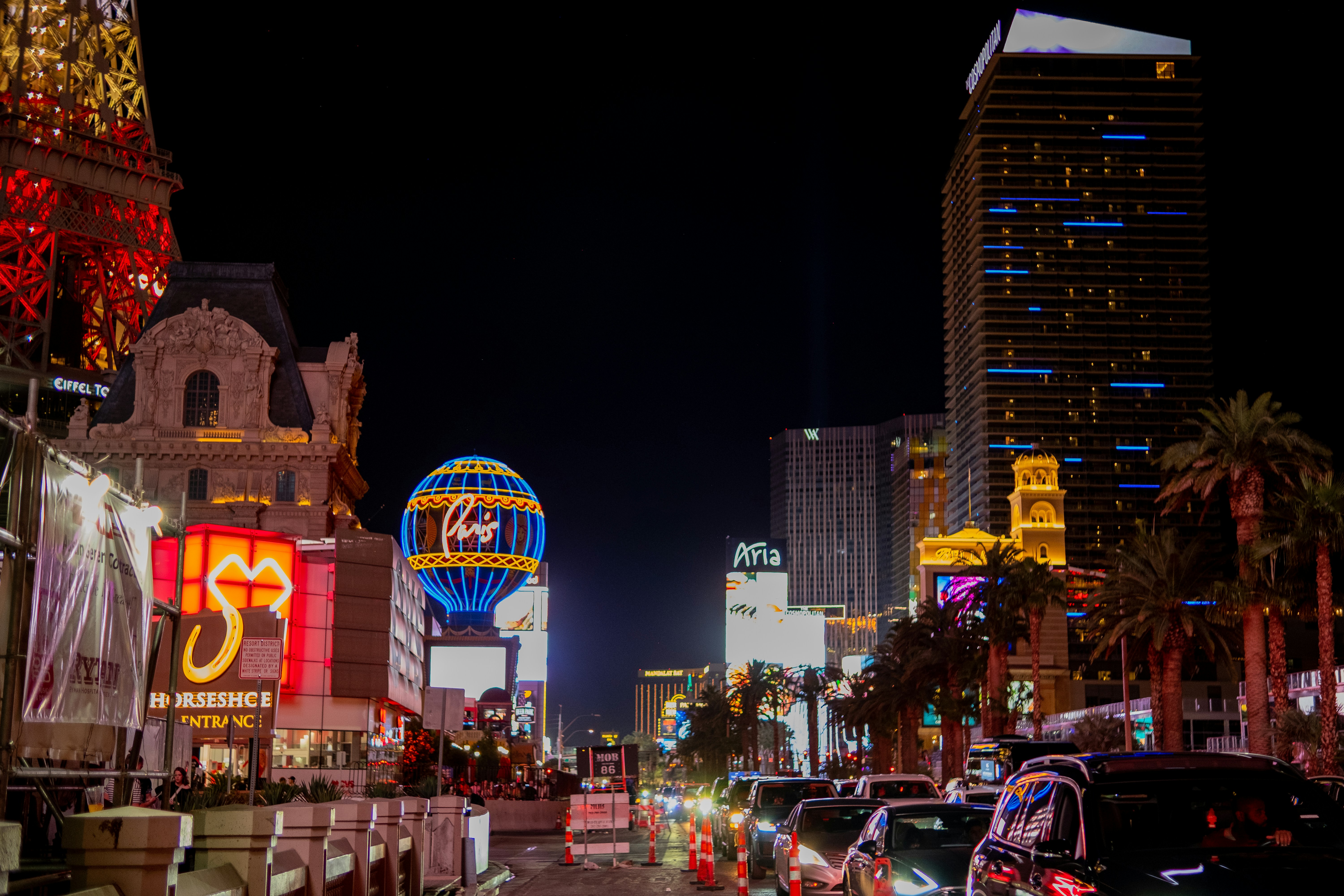 Illuminated Las Vegas strip at night with city lights and bustling crowds