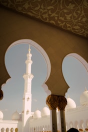 a large white building with arches and arches