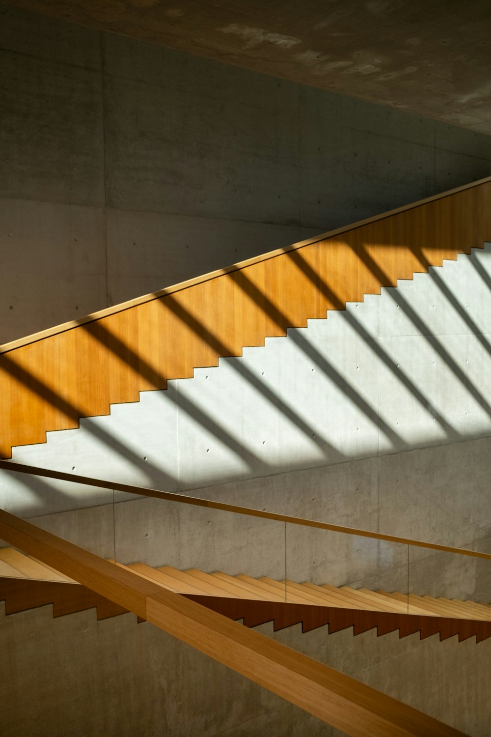 a stair case with wooden handrails in a building