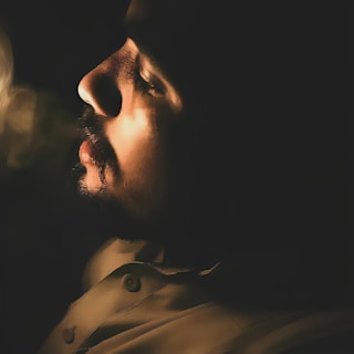 A captivating still of Mukhi performing in a dramatic scene.