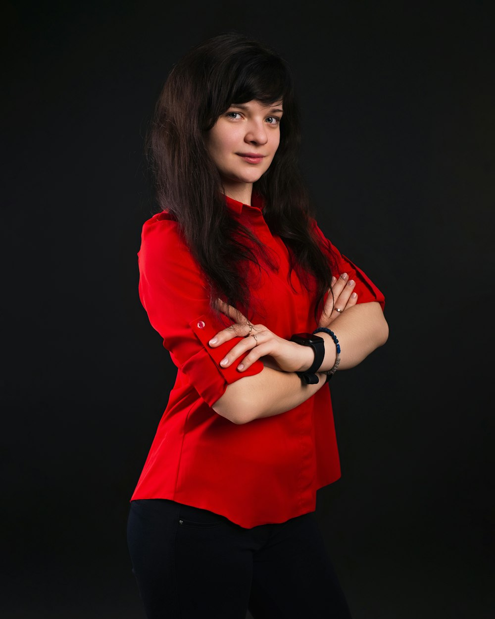 a woman in a red shirt posing for a picture