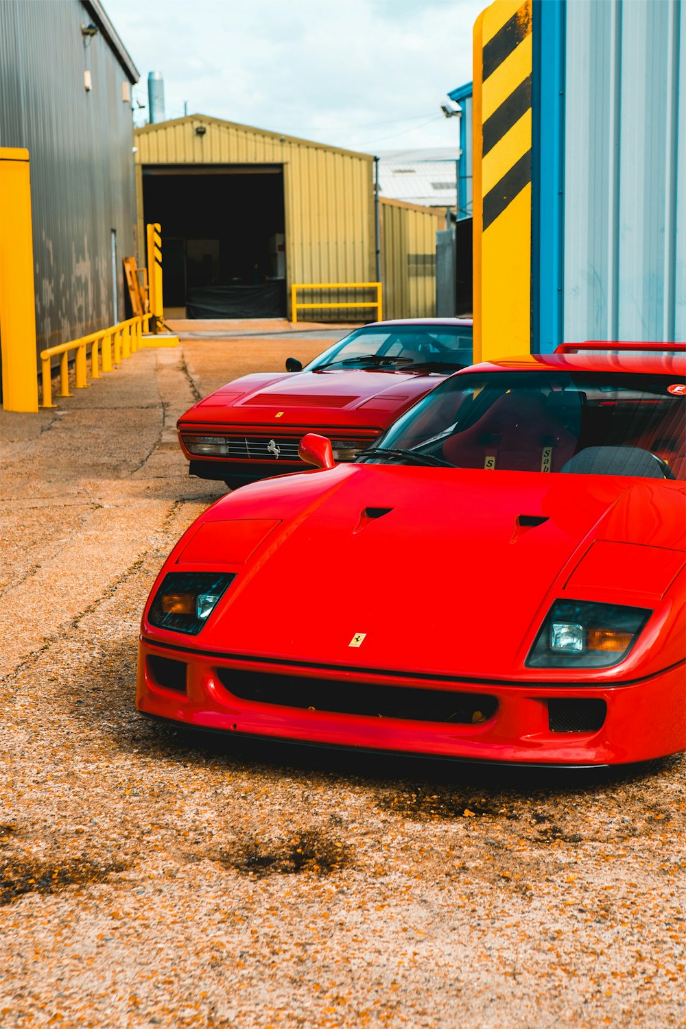 a red sports car parked in front of a building