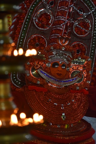 An ancient shamanic mask illuminated by flickering candlelight, evoking mystery and tradition.