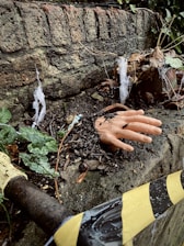 a hand that is laying on the ground