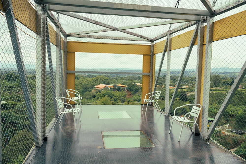 a room with a view of the trees and the sky