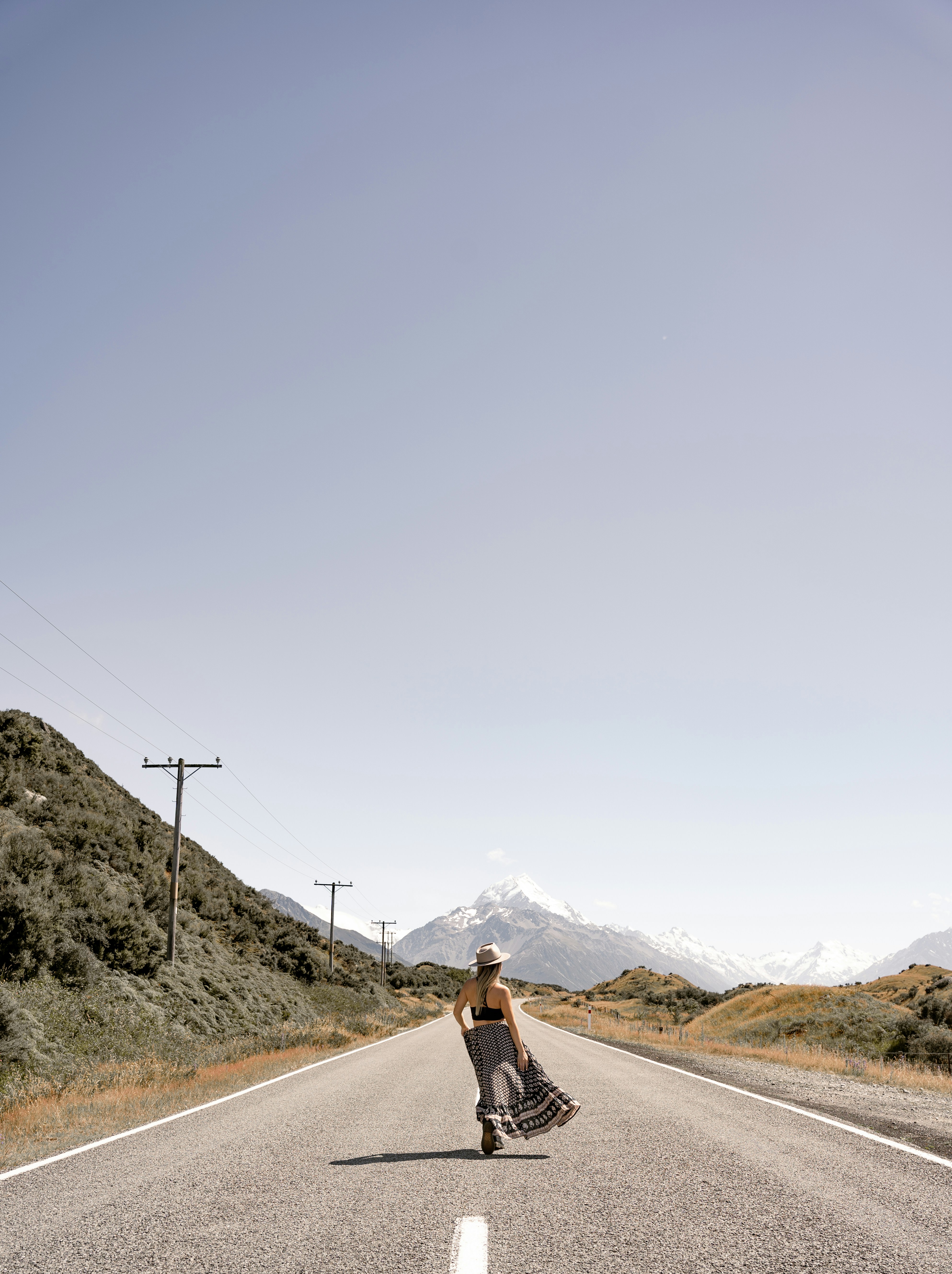 a person standing on the side of a road