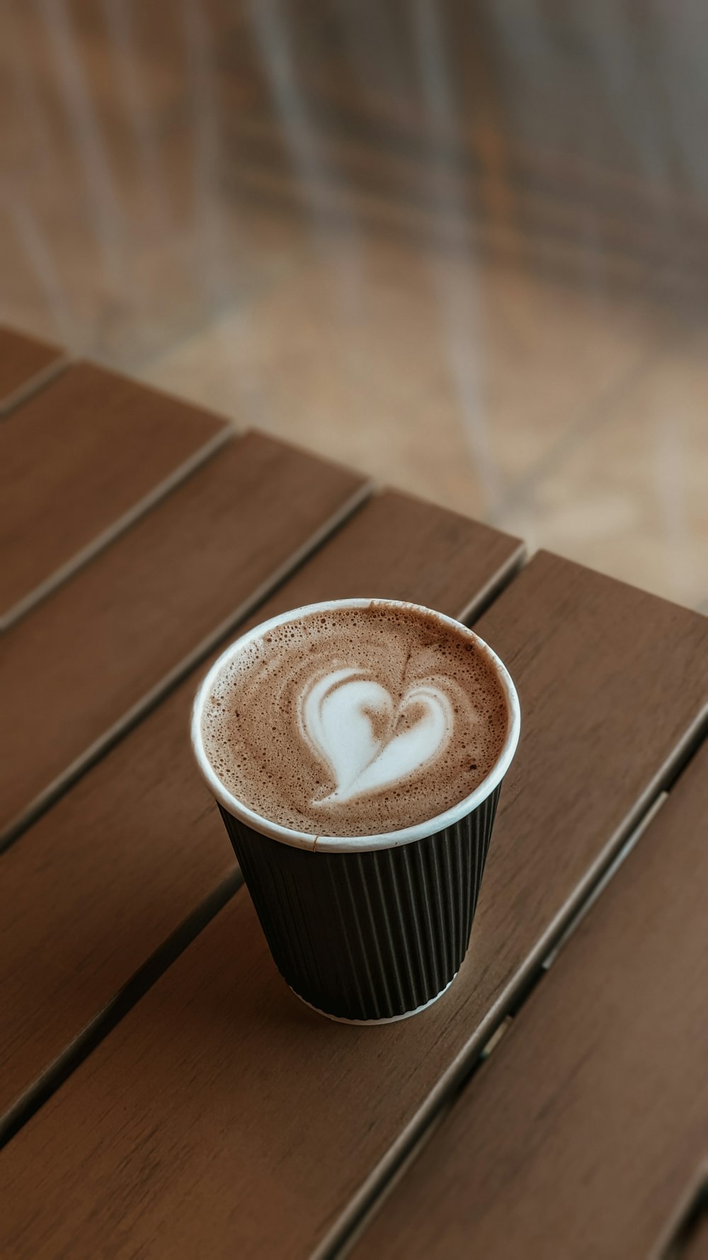 a cup of coffee with a heart on it