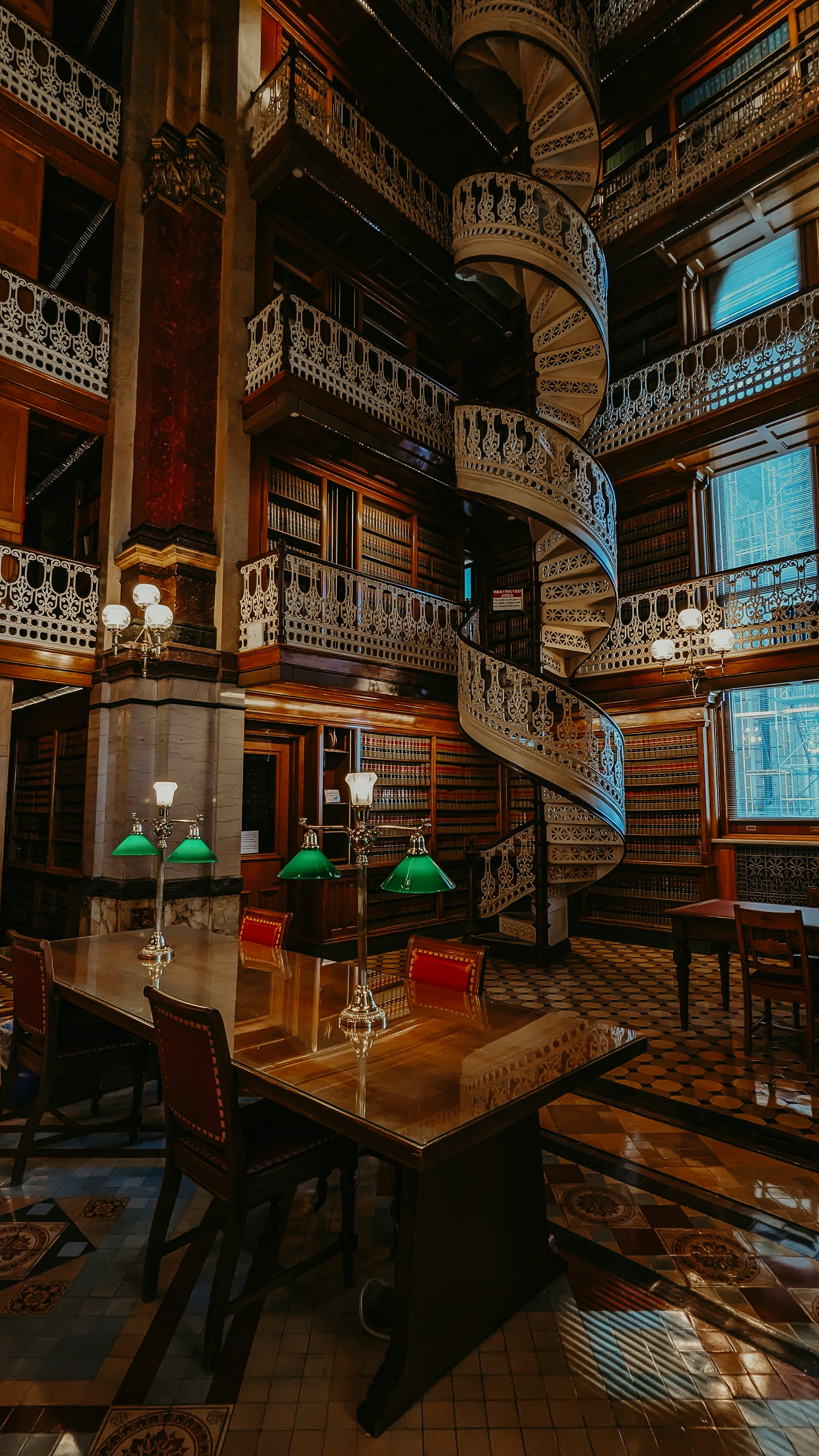 a room with a spiral staircase in the middle of it