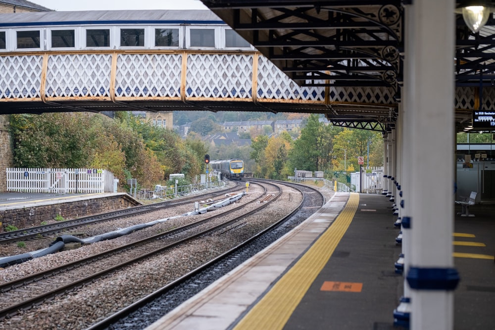 a train station with a train on the tracks