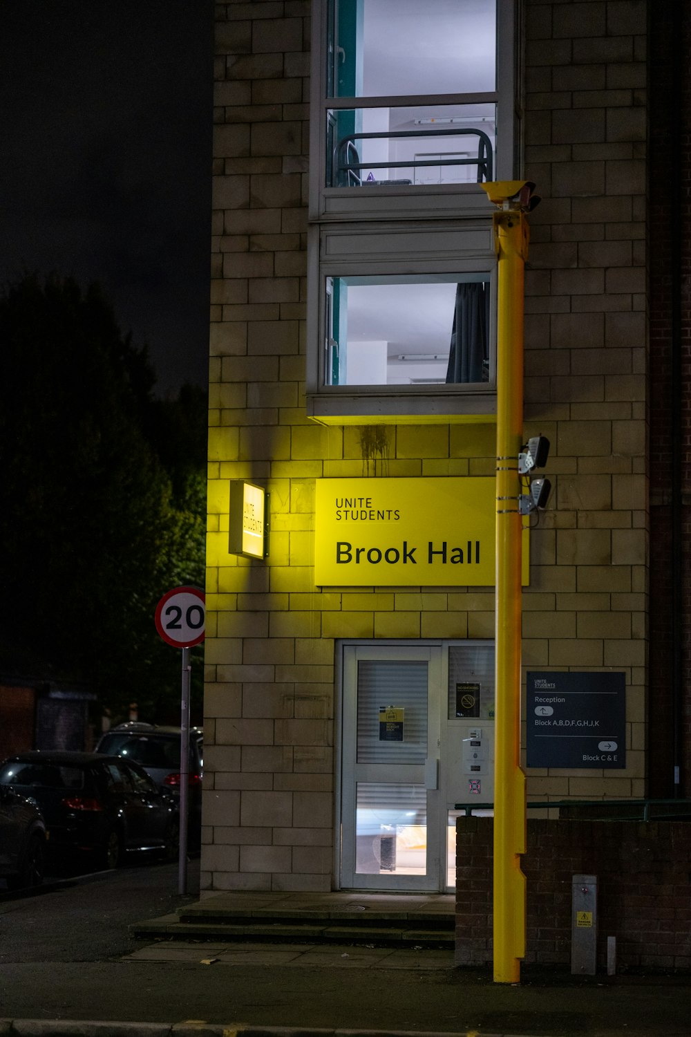 a building that has a yellow light on it