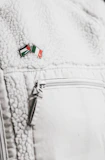 Close-up of rugged military-style jacket with Spartan emblem