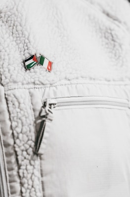 Close-up of a sleek cyberjack jacket featuring modular pouches and hexagon pattern accents.