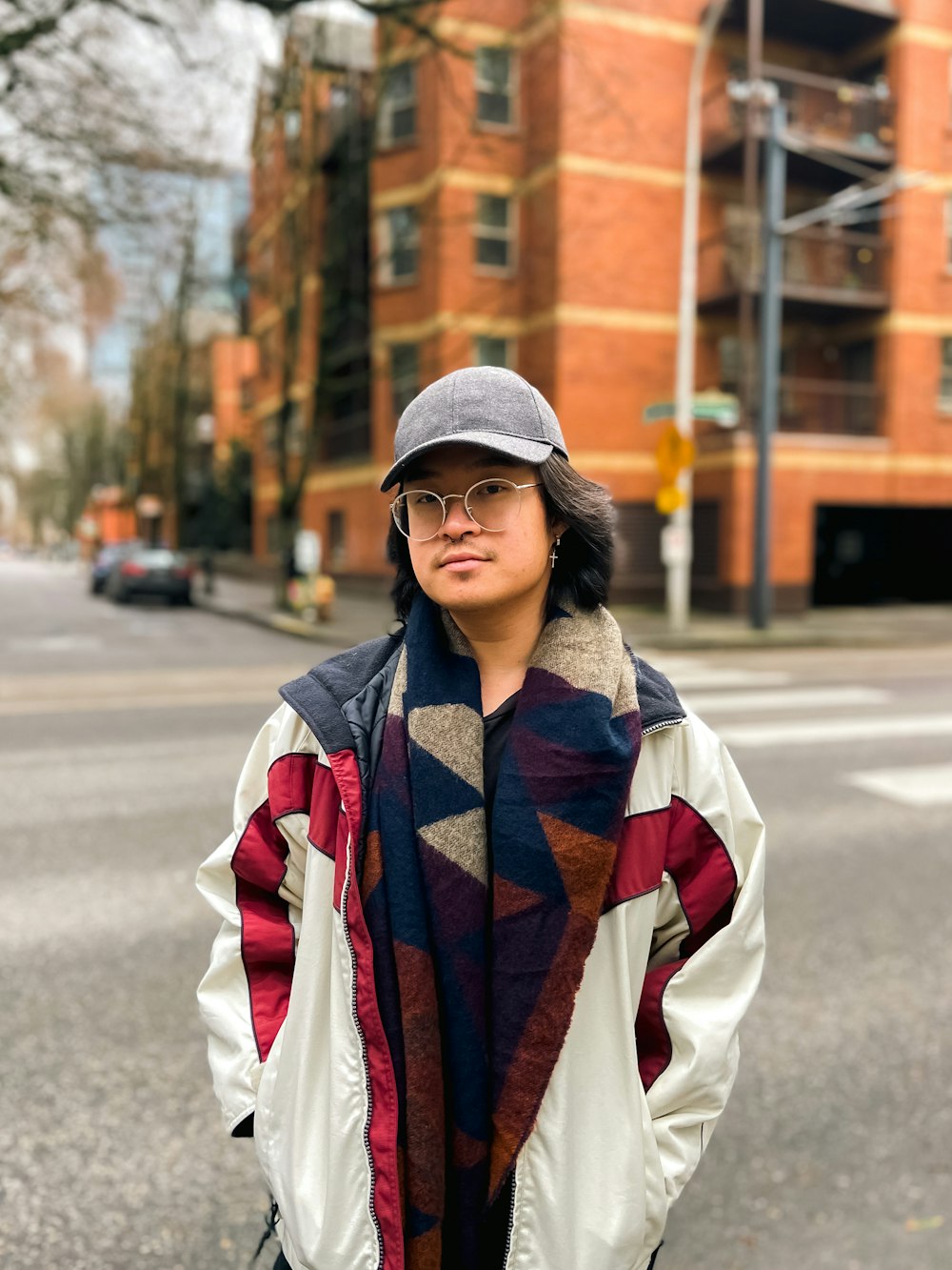 a woman standing on the side of the road