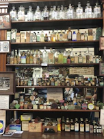 Stacked apothecary products with visible price tags in euros, highlighting the medshop interface.