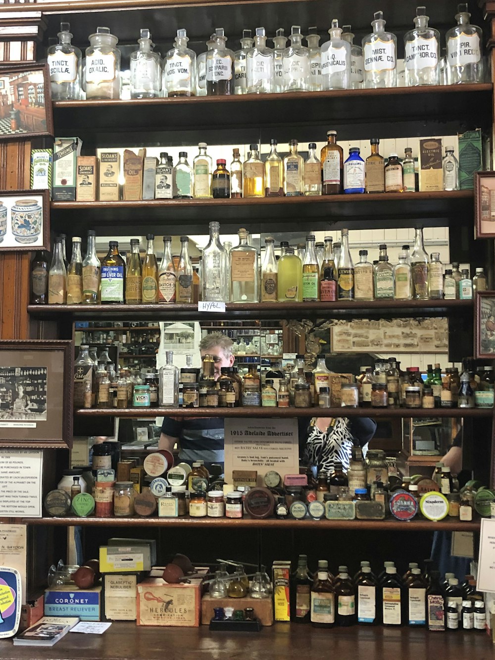 a shelf filled with lots of different types of bottles