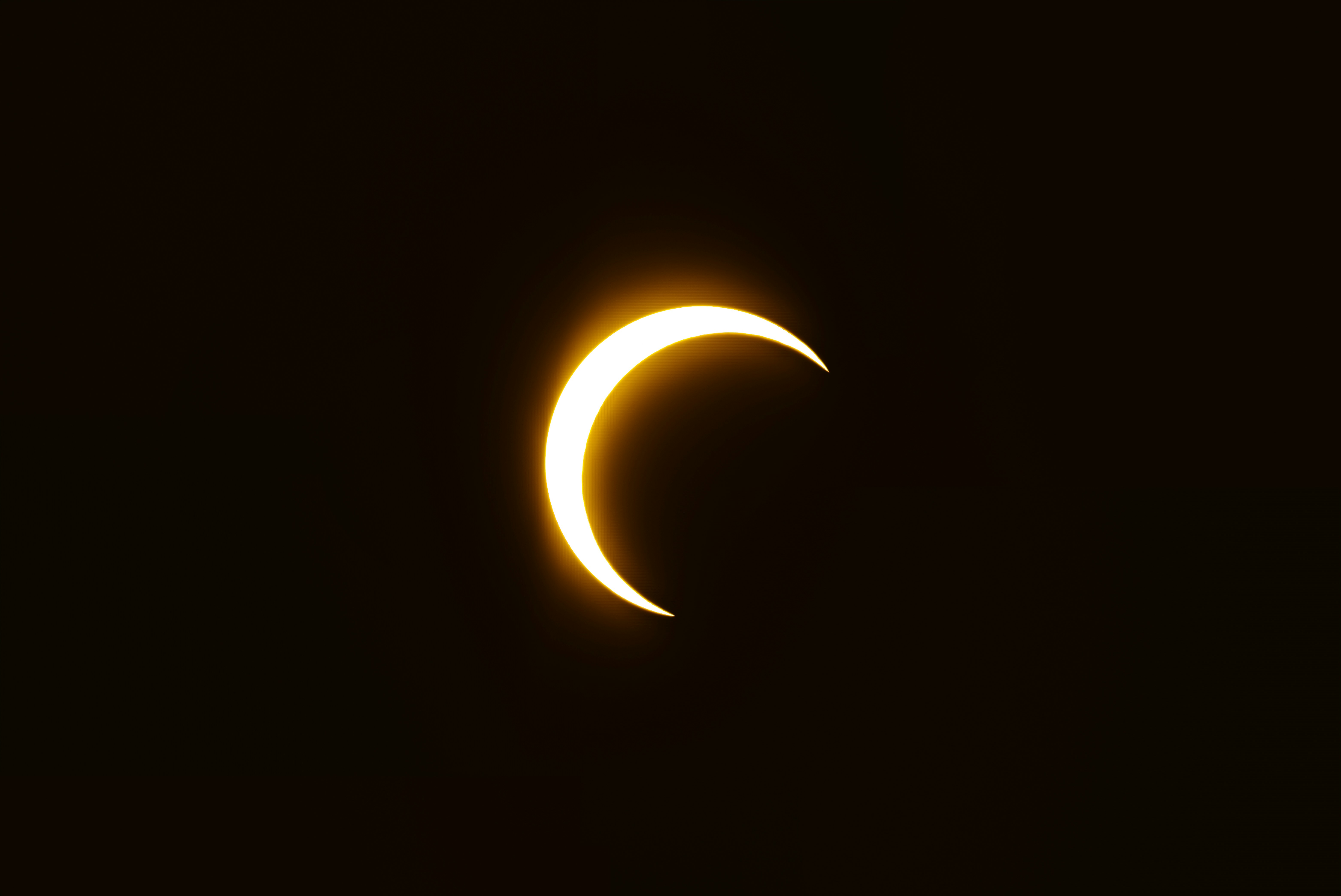 a solar eclipse in the dark sky