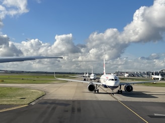 a large jetliner sitting on top of an airport runway
