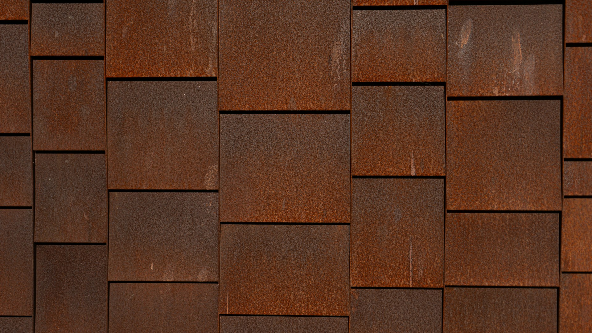 a bird is perched on a wooden wall