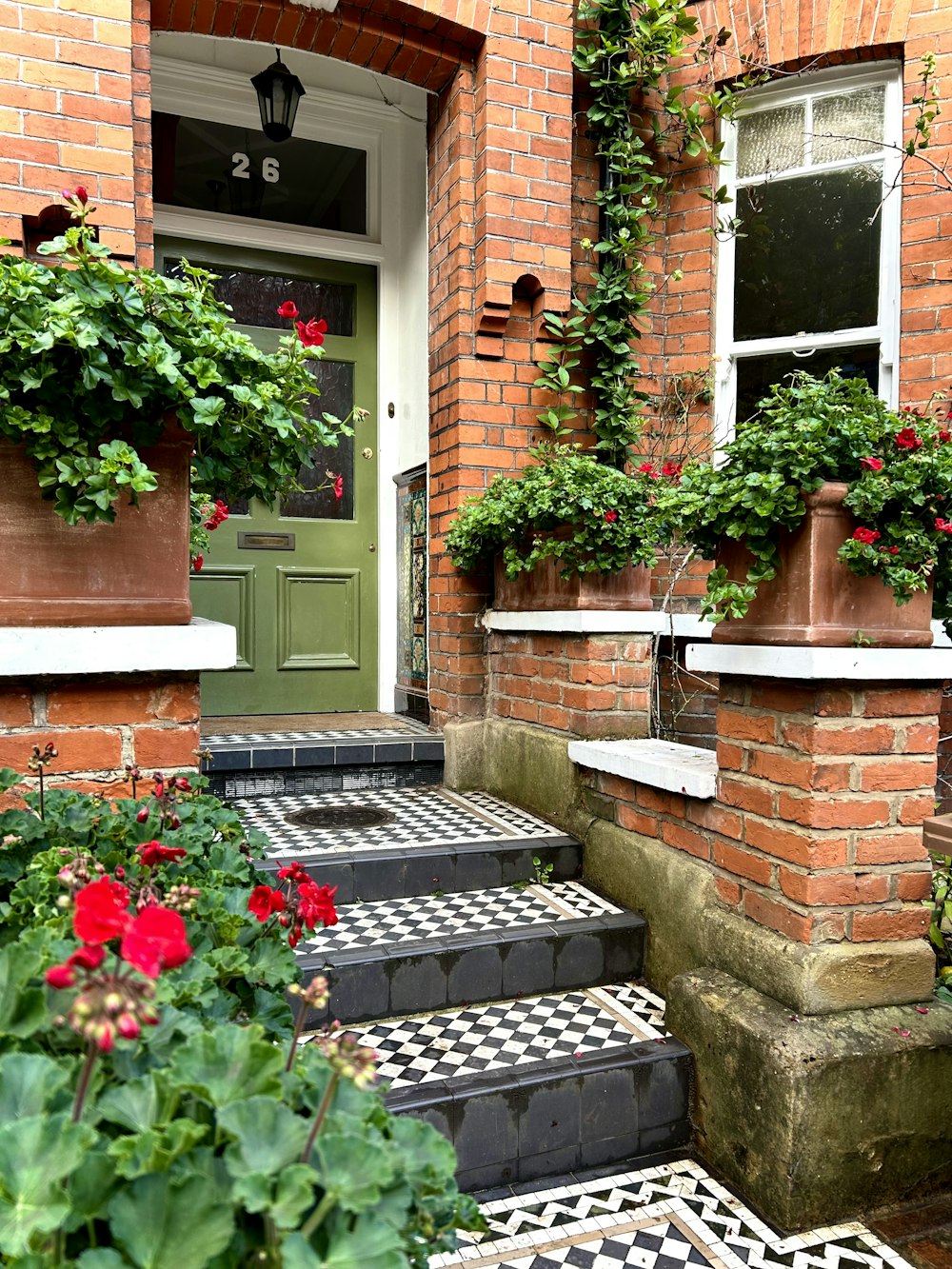 a set of steps leading up to a green door