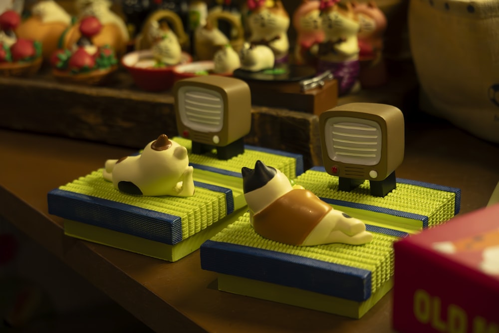 a close up of three toy animals on a table