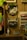 The image features a display of various cat-themed items on wooden shelves and background. There are two decorative cat vases mounted on the wall, one with leaves coming out of the top, resembling a plant. Below the vases, stuffed cat toys and other cat-themed merchandise are arranged neatly.