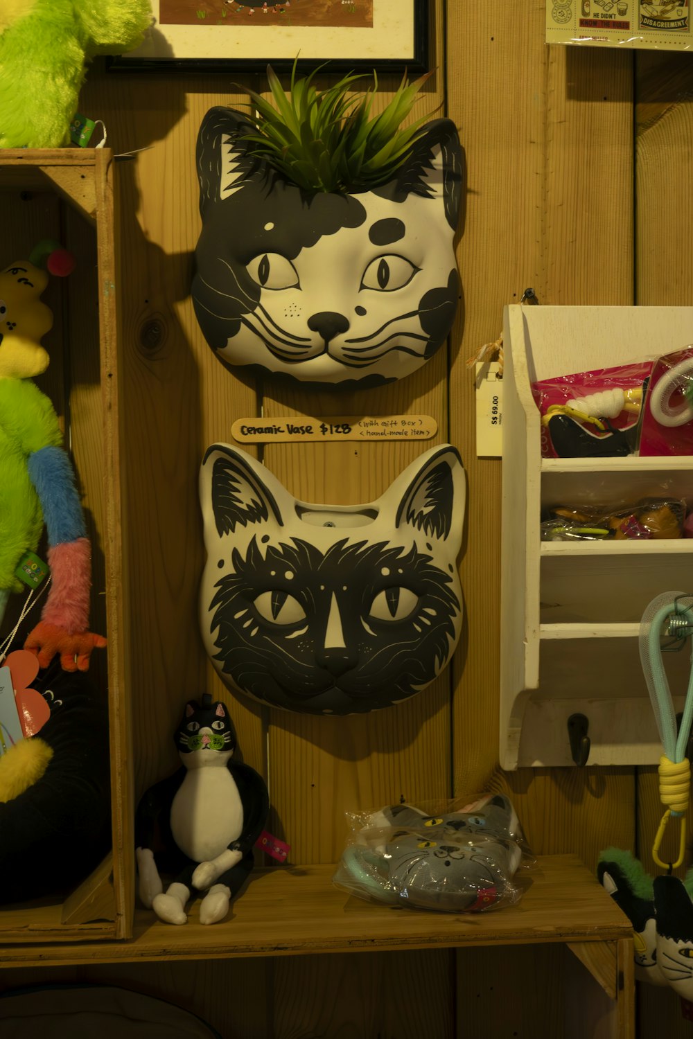 a shelf filled with stuffed animals and stuffed animals