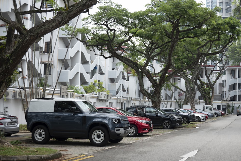 a row of cars parked on the side of a street