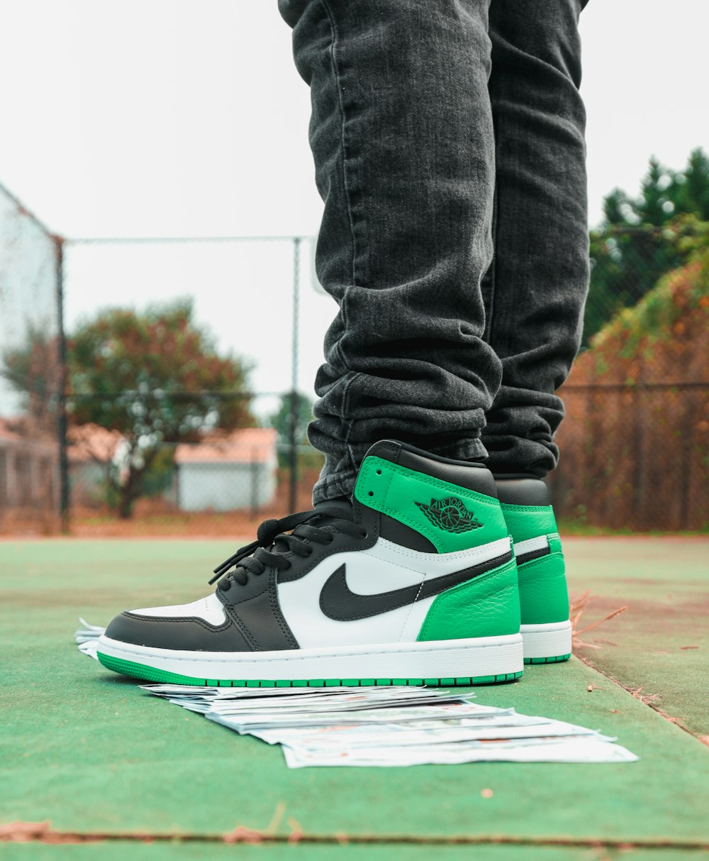 a person standing on top of a tennis court