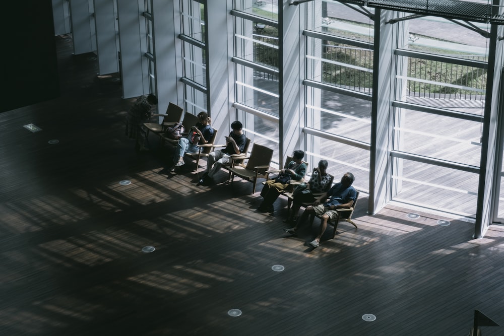 a group of people sitting in a waiting area