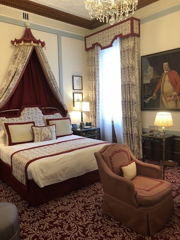A luxurious bedroom with plush bedding and elegant furnishings, perfect for relaxation.