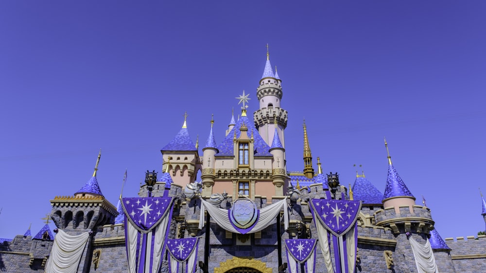 a castle with purple and blue decorations on it