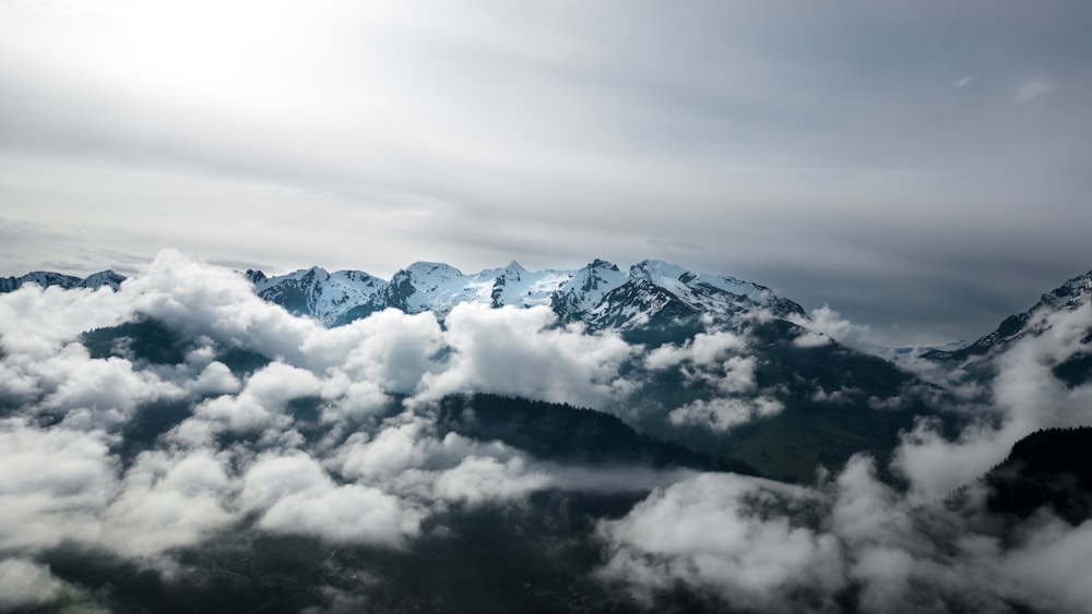 a view of a mountain range covered in clouds