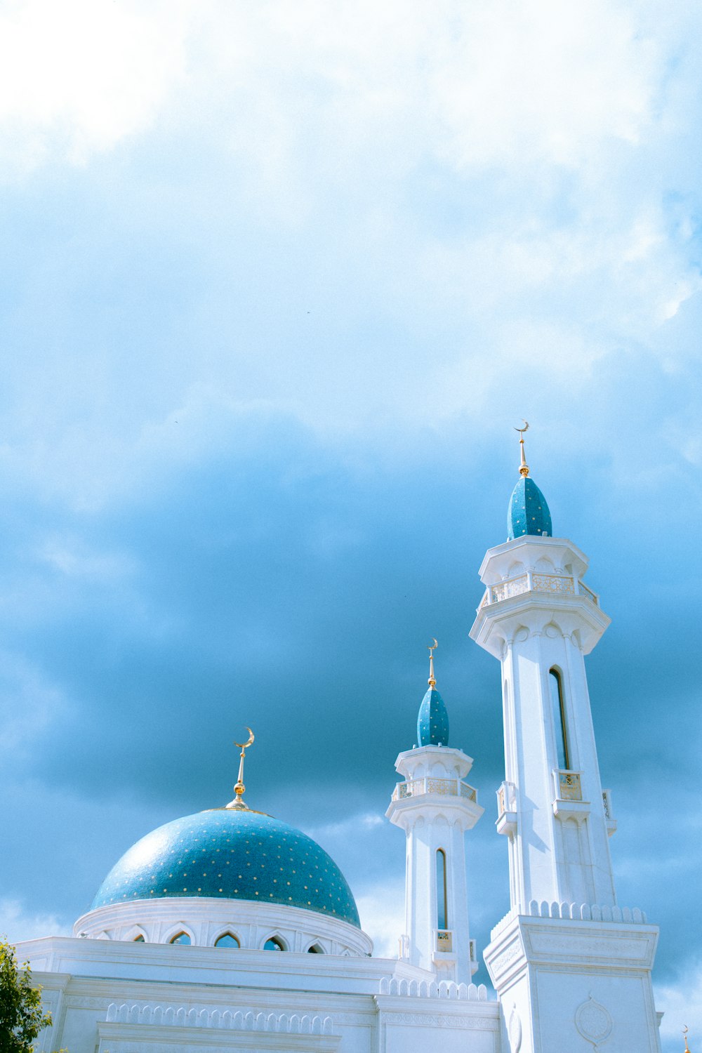 a large white building with a blue dome