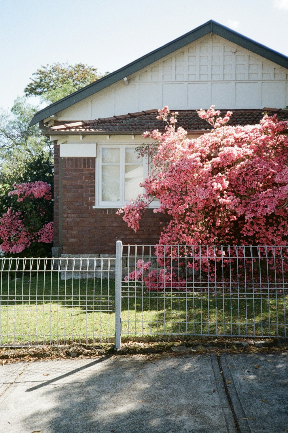 a house with a fence in front of it