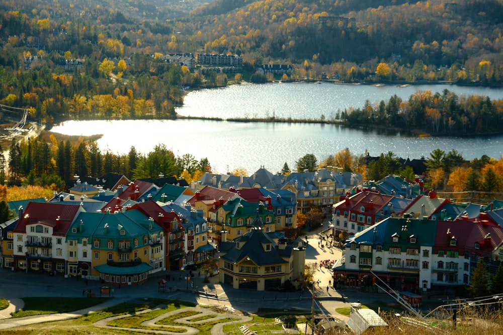 a view of a town with a lake in the background