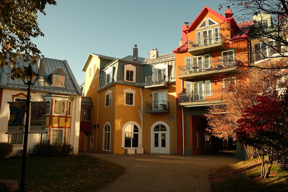 a yellow building with many windows and balconies