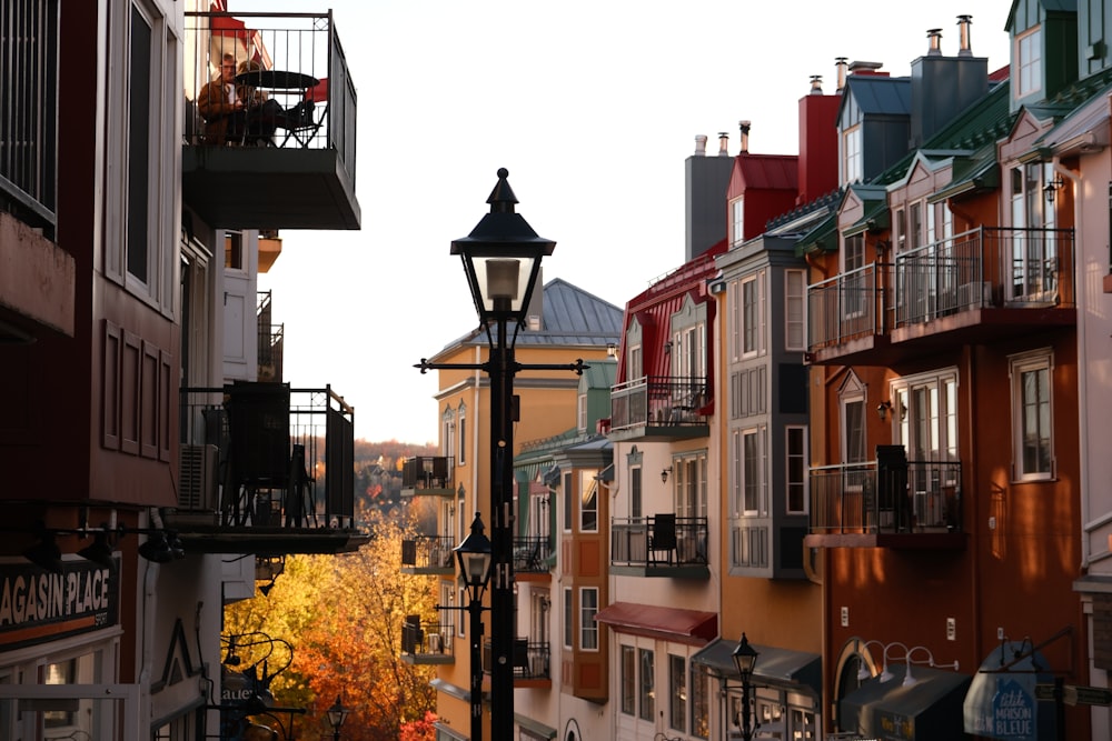 a street light in front of a row of buildings